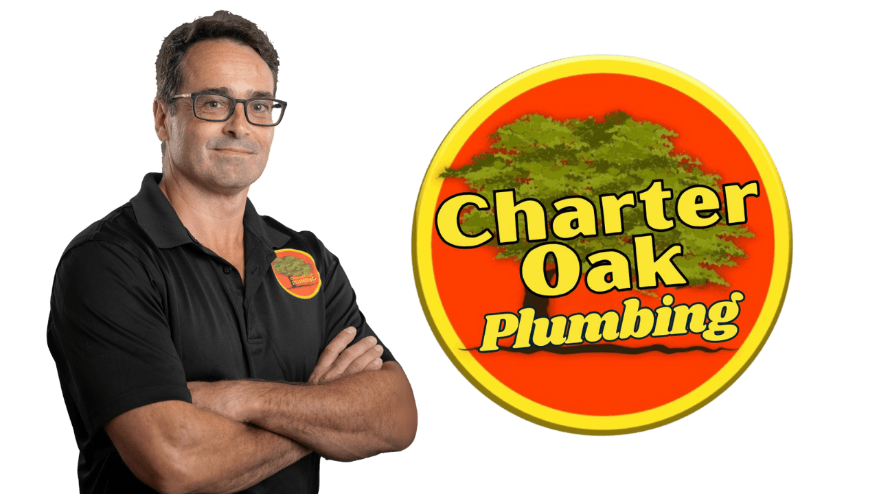 Owner of Charter Oak Plumbing wearing company uniform, confidently smiling with arms crossed — expert plumber serving Southington, CT and surrounding areas.